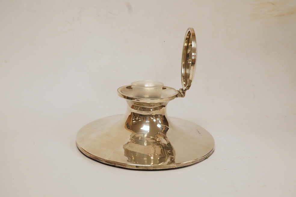 A George V silver mounted capstan inkwell, maker's mark rubbed, Birmingham, 1911, with later plastic well, base diameter 17.7cm. Condition - fair